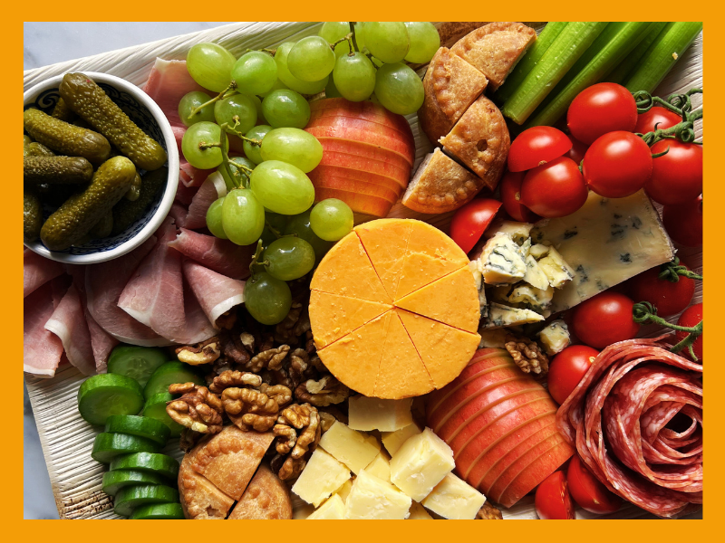 Close-up of artisan cheeses and accompaniments